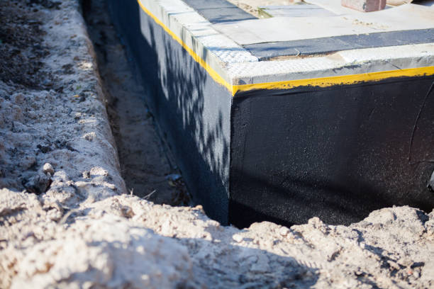 Professional Waterproofing technician working in Dundee, MI